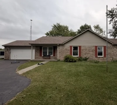 Brick ranch home with its finished new shingle roof
