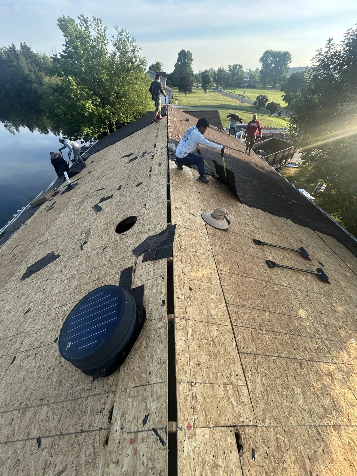 Roofing work along a roof ridge
