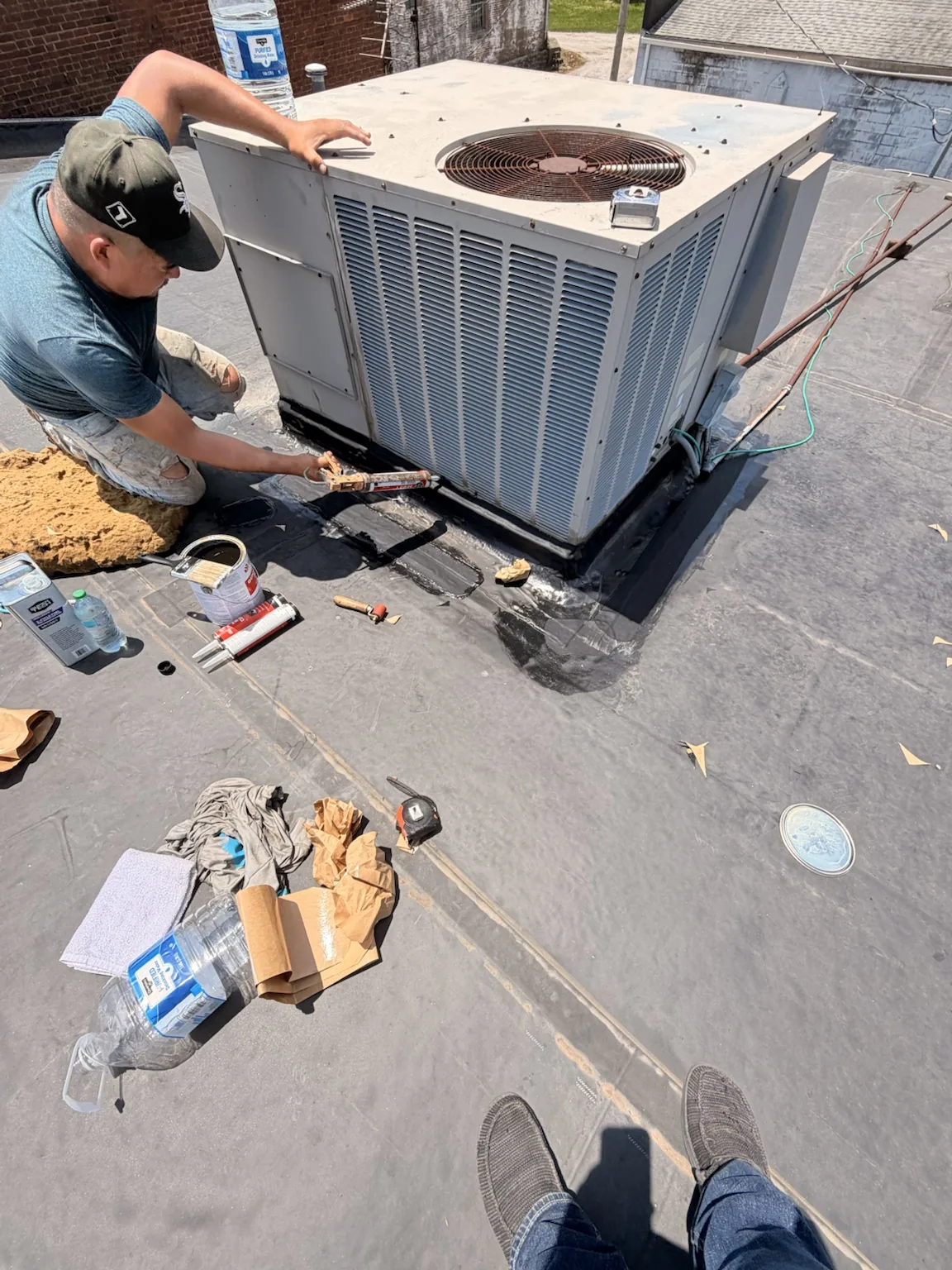Roofing project equipment and jobsite work by Sealed Solutions Roofing