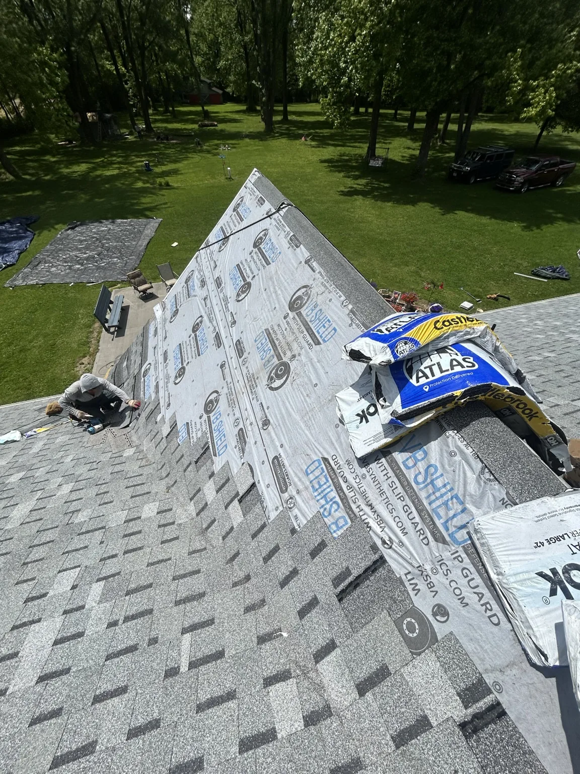 Shingle and underlayment installation in progress